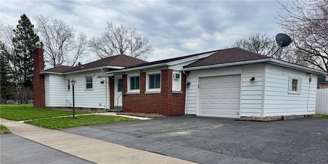 2201 Dewey Ave, Rochester, NY 14615 - ranch-style home featuring a garage, asphalt driveway, a front lawn, brick siding, and a chimney