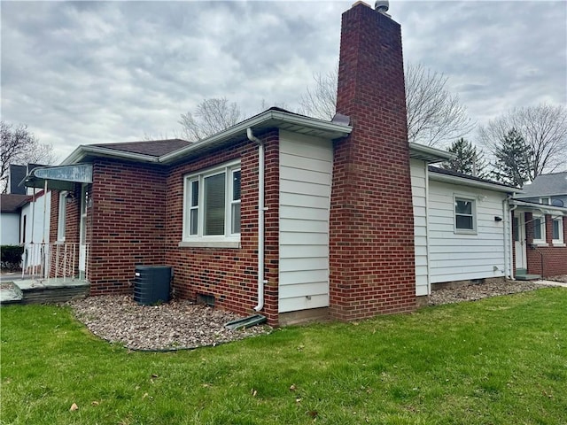 2201 Dewey Ave, Rochester, NY 14615 - view of property exterior featuring a chimney, a lawn, and brick siding