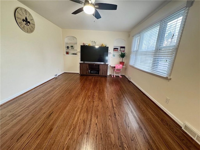 2201 Dewey Ave, Rochester, NY 14615 - living area with ceiling fan, wood finished floors, and built in shelves