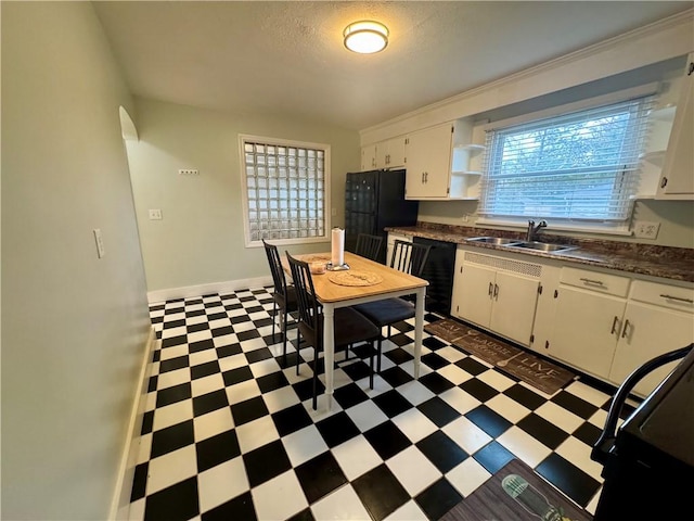2201 Dewey Ave, Rochester, NY 14615 - kitchen featuring tile patterned floors, open shelves, dark countertops, and white cabinets