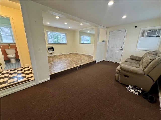 2201 Dewey Ave, Rochester, NY 14615 - unfurnished living room with recessed lighting, dark carpet, and heating unit