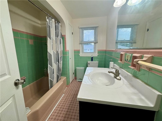 2201 Dewey Ave, Rochester, NY 14615 - full bath featuring tile walls, vanity, tile patterned floors, shower / tub combo with curtain, and a wainscoted wall