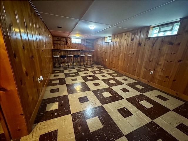 2201 Dewey Ave, Rochester, NY 14615 - below grade area featuring tile patterned floors and wooden walls