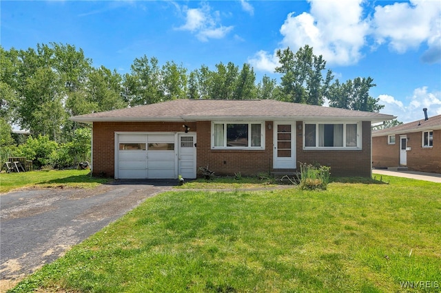 85 Pacific Ave, Lackawanna, NY 14218 - view of front of home with asphalt driveway, an attached garage, brick siding, and a front yard