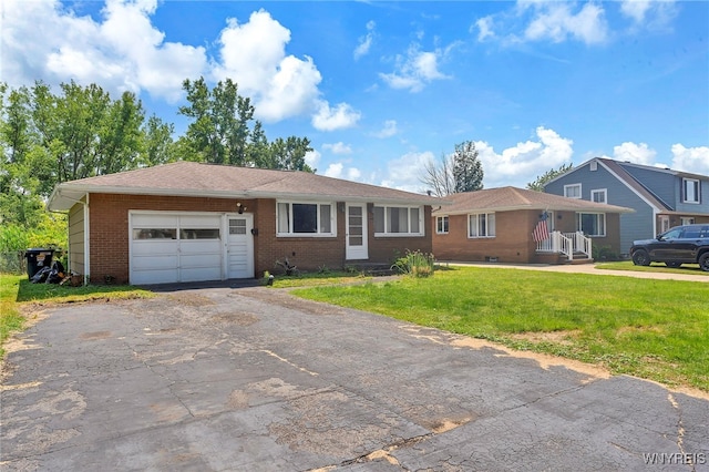 85 Pacific Ave, Lackawanna, NY 14218 - single story home featuring an attached garage, driveway, a front lawn, and brick siding
