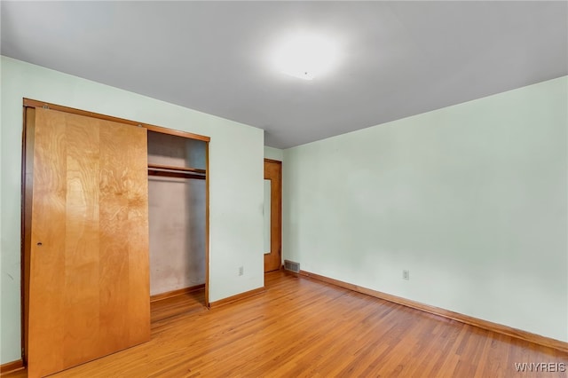 85 Pacific Ave, Lackawanna, NY 14218 - unfurnished bedroom with light wood-style flooring and a closet