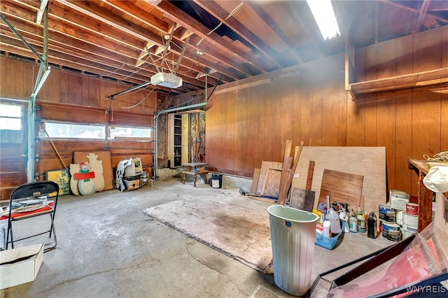 85 Pacific Ave, Lackawanna, NY 14218 - garage with wooden walls and a garage door opener