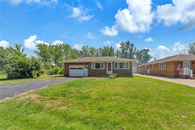 85 Pacific Ave, Lackawanna, NY 14218 - ranch-style home with driveway, a garage, brick siding, and a front lawn