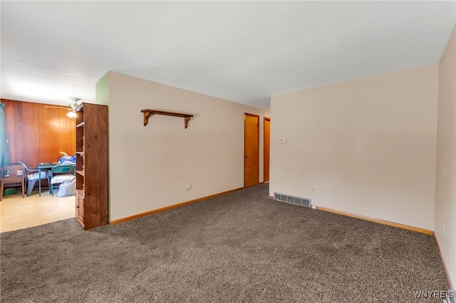 85 Pacific Ave, Lackawanna, NY 14218 - empty room with carpet floors and wood walls