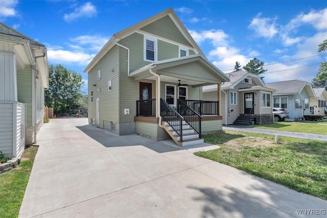 67 Amber St, Buffalo, NY 14220 - view of front of property with driveway, a porch, and a front yard