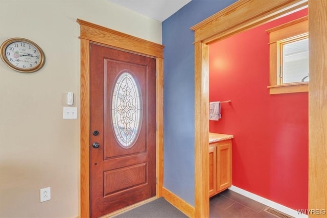 67 Amber St, Buffalo, NY 14220 - entryway featuring baseboards and dark tile patterned flooring