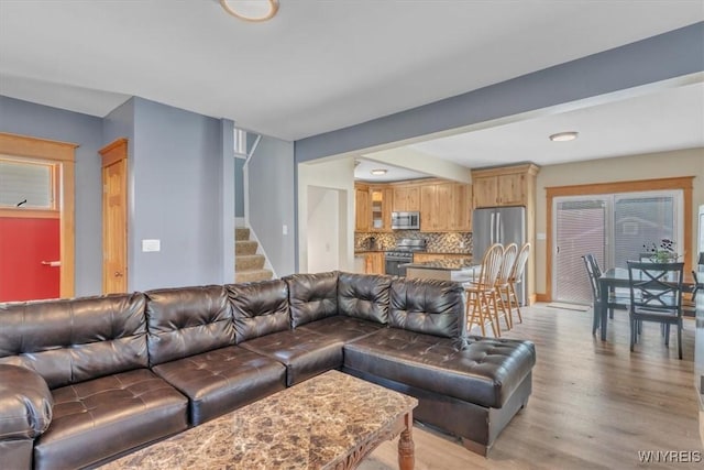 67 Amber St, Buffalo, NY 14220 - living room with stairs, light wood-type flooring, and recessed lighting
