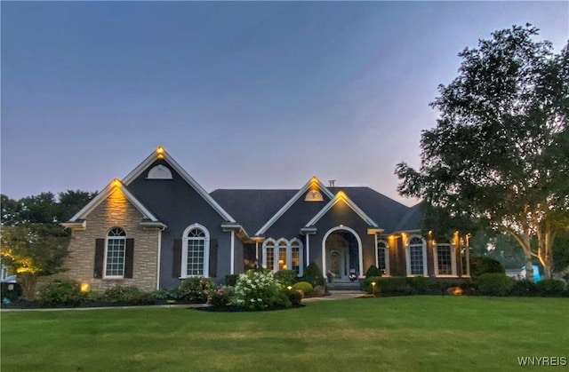 6480 Edgewood Dr, Lockport Town, NY 14094 - traditional home featuring a lawn and stone siding