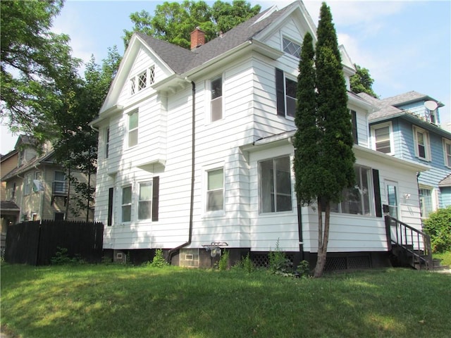 176 Selye Ter, Rochester, NY 14613 - view of side of property with a chimney, a yard, and entry steps
