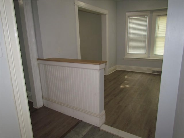 176 Selye Ter, Rochester, NY 14613 - corridor with dark wood-style flooring and baseboards
