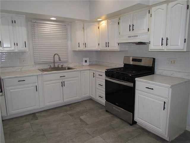 176 Selye Ter, Rochester, NY 14613 - kitchen featuring gas stove, tasteful backsplash, under cabinet range hood, white cabinetry, and light countertops