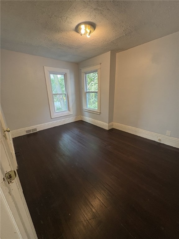 176 Selye Ter, Rochester, NY 14613 - spare room featuring dark wood finished floors and a textured ceiling