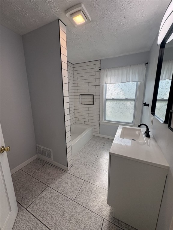 176 Selye Ter, Rochester, NY 14613 - full bathroom with vanity and a textured ceiling