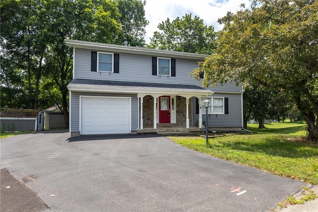 15 Dogwood Ln, Erwin, NY 14870 - traditional-style house featuring covered porch, a front lawn, a garage, driveway, and a shed