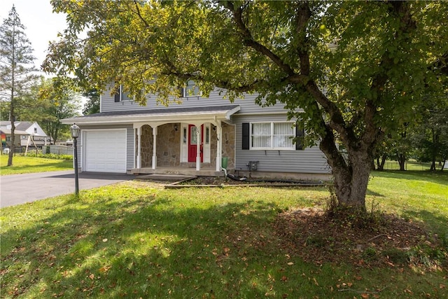 15 Dogwood Ln, Erwin, NY 14870 - view of front facade with a porch, a garage, driveway, a front lawn, and stone siding