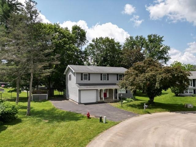 15 Dogwood Ln, Erwin, NY 14870 - traditional-style house with a garage, asphalt driveway, and a front lawn