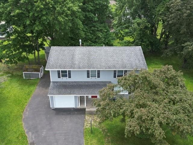 15 Dogwood Ln, Erwin, NY 14870 - view of front of property with driveway, a front lawn, a shingled roof, and a garage
