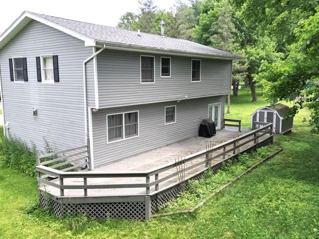 15 Dogwood Ln, Erwin, NY 14870 - rear view of property with a storage shed, a lawn, and a wooden deck