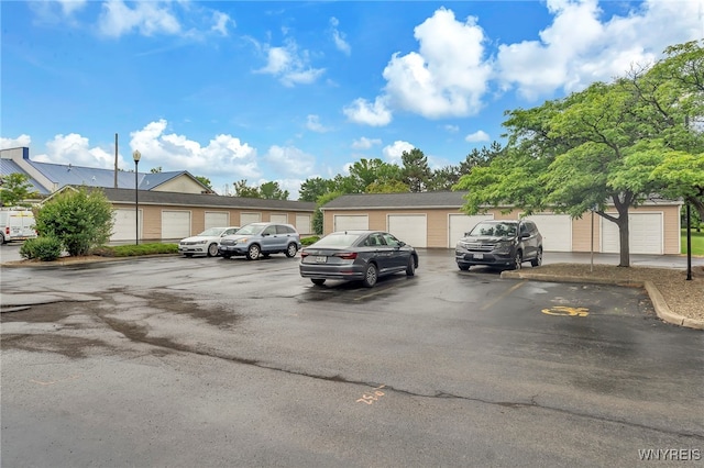 306 Sundown Unit 3C, Amherst, NY 14221 - uncovered parking lot with community garages