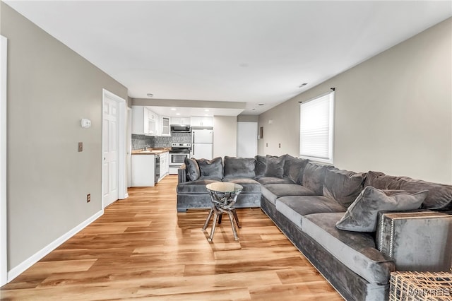 306 Sundown Unit 3C, Amherst, NY 14221 - living room featuring light wood-style flooring and recessed lighting