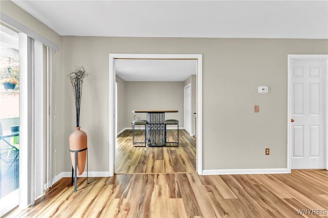 306 Sundown Unit 3C, Amherst, NY 14221 - unfurnished dining area with light wood finished floors and baseboards