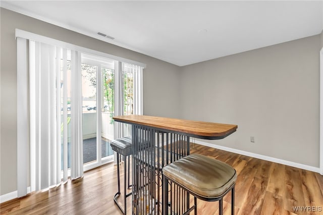 306 Sundown Unit 3C, Amherst, NY 14221 - dining space featuring baseboards and wood finished floors