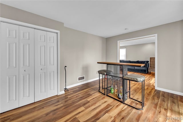 306 Sundown Unit 3C, Amherst, NY 14221 - dining room with wood finished floors and baseboards