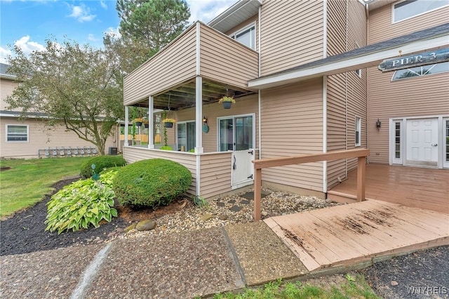 306 Sundown Unit 3C, Amherst, NY 14221 - back of house featuring a balcony and a wooden deck