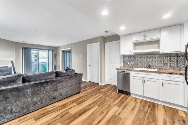 306 Sundown Unit 3C, Amherst, NY 14221 - kitchen featuring open floor plan, light wood-type flooring, white cabinetry, tasteful backsplash, and open shelves