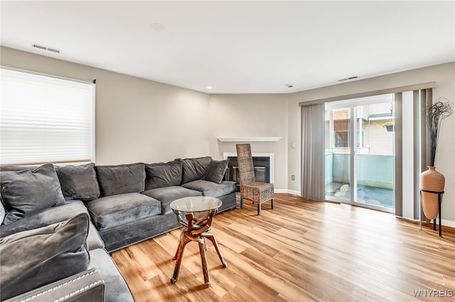 306 Sundown Unit 3C, Amherst, NY 14221 - living area featuring light wood-style flooring, recessed lighting, and a brick fireplace
