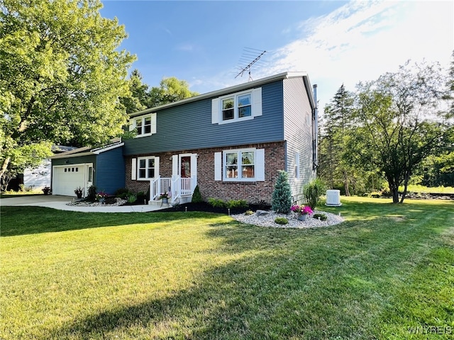73 Eaglebrook Dr, Orchard Park, NY 14224 - colonial home with a garage, brick siding, a front lawn, and concrete driveway