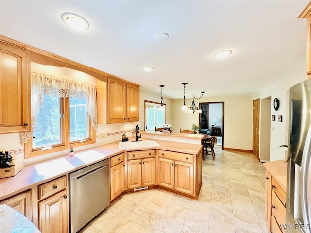 73 Eaglebrook Dr, Orchard Park, NY 14224 - kitchen with appliances with stainless steel finishes, a peninsula, decorative light fixtures, light countertops, and recessed lighting