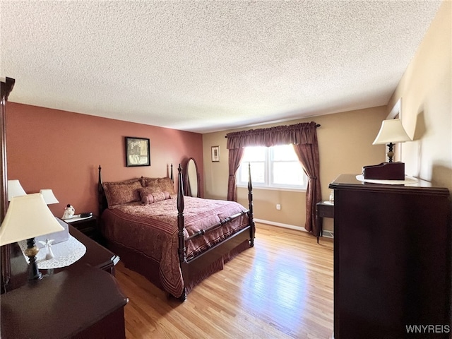 73 Eaglebrook Dr, Orchard Park, NY 14224 - bedroom with light wood-type flooring and a textured ceiling