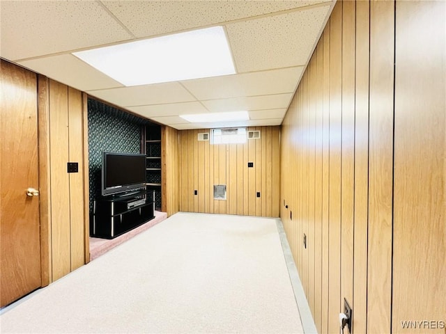 73 Eaglebrook Dr, Orchard Park, NY 14224 - below grade area featuring wood walls, carpet flooring, and a paneled ceiling