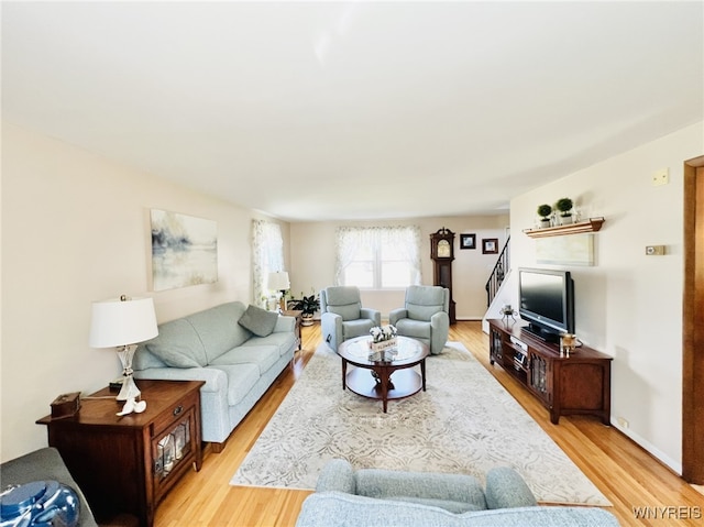 73 Eaglebrook Dr, Orchard Park, NY 14224 - living room featuring light wood-type flooring and stairway