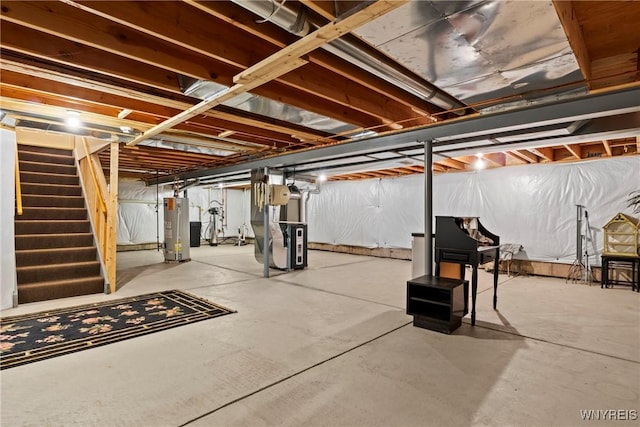 6 Fair Woods Dr, Amherst, NY 14221 - unfinished basement with stairs, gas water heater, and heating unit