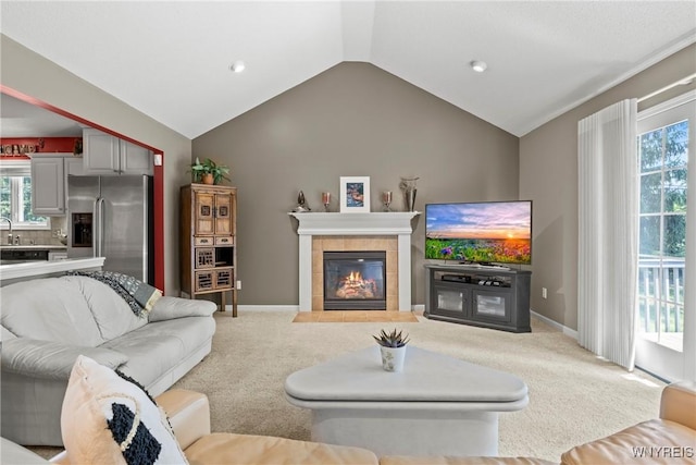 6 Fair Woods Dr, Amherst, NY 14221 - living room featuring carpet flooring, vaulted ceiling, plenty of natural light, a fireplace, and recessed lighting
