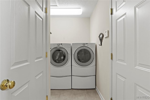 6 Fair Woods Dr, Amherst, NY 14221 - laundry room with washer and dryer, light tile patterned flooring, and a textured ceiling
