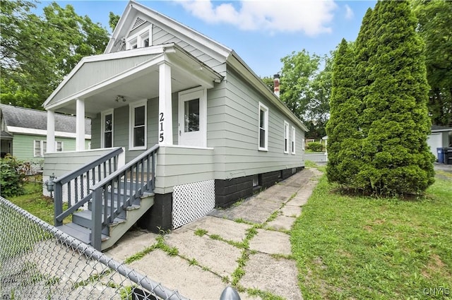 215 Vann St, Syracuse, NY 13206 - view of front of property featuring a chimney and covered porch
