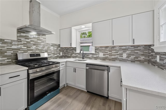 215 Vann St, Syracuse, NY 13206 - kitchen with stainless steel appliances, exhaust hood, white cabinets, and ornamental molding