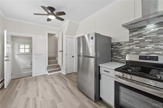 215 Vann St, Syracuse, NY 13206 - kitchen featuring appliances with stainless steel finishes, wall chimney exhaust hood, ceiling fan, light wood finished floors, and ornamental molding