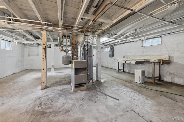 215 Vann St, Syracuse, NY 13206 - below grade area with a heating unit, electric panel, and plenty of natural light