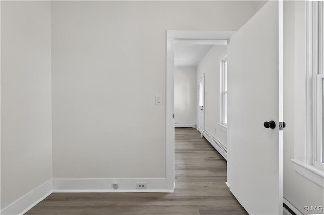 215 Vann St, Syracuse, NY 13206 - corridor featuring wood finished floors and baseboard heating