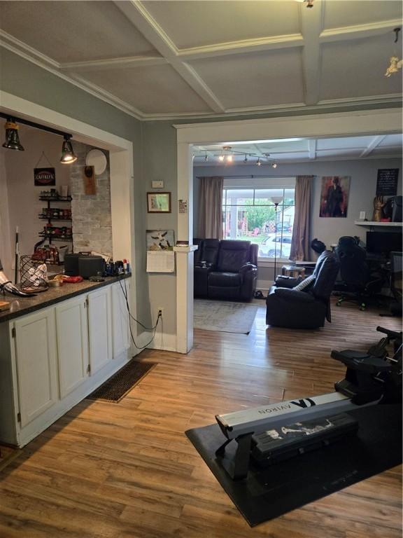 262 E 3rd St, Corning City, NY 14830 - living area with coffered ceiling, light wood finished floors, and beamed ceiling