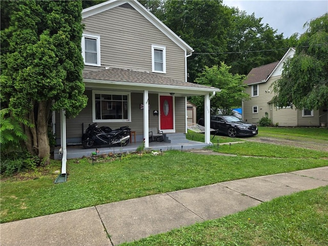 262 E 3rd St, Corning City, NY 14830 - view of front of home with a front lawn, a porch, and a shingled roof